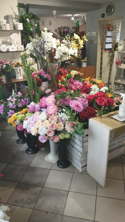 Azalia. Kwiaciarnia, dowóz kwiatów. Pluta R., Kwiaciarnia w Koźmin Wielkopolski